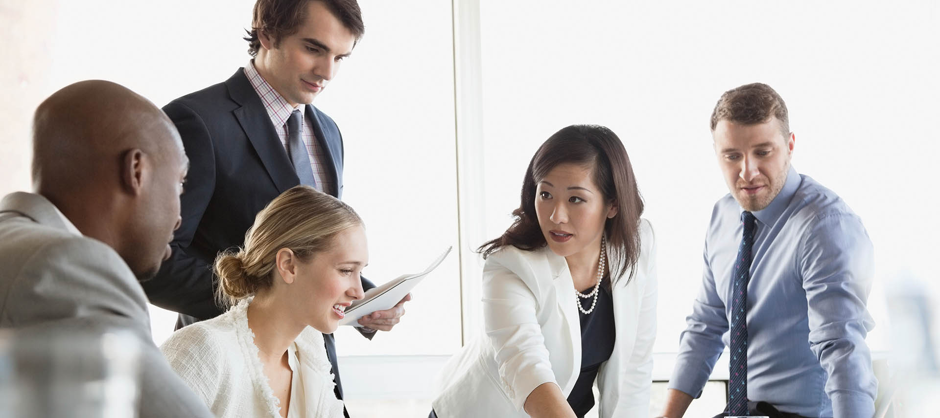 Business woman presenting to group. 