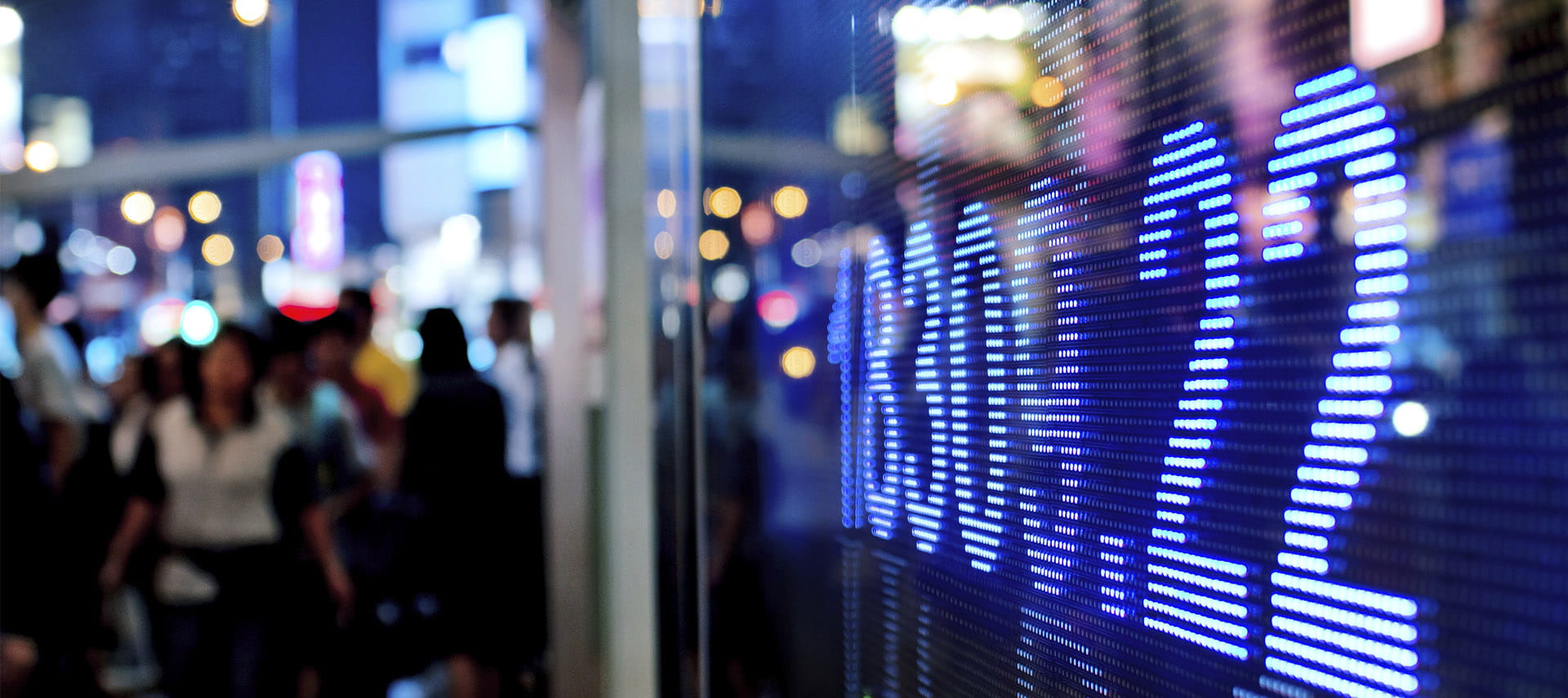 Numbers on screen with a crowd in the background.