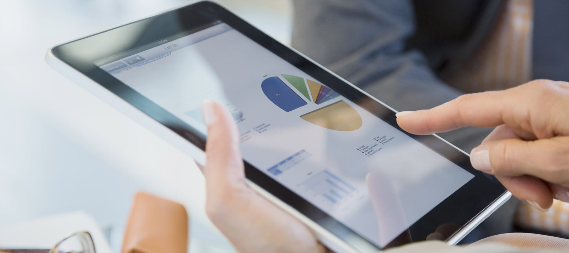 Person looking at a chart on a tablet.